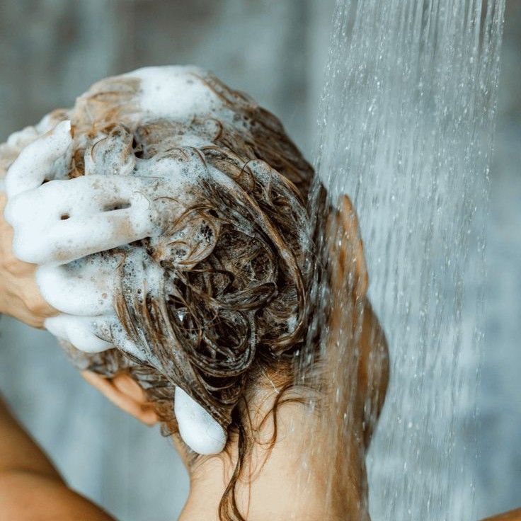 Gentle hair drying with a microfiber towel.