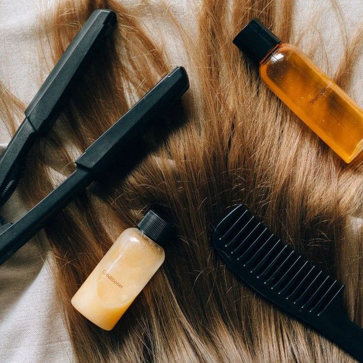 Applying a nourishing mask for deep hair restoration.