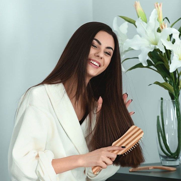 Using a silk pillowcase to protect hair during sleep.
