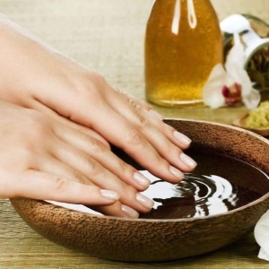 Hands soaking in a nourishing bath